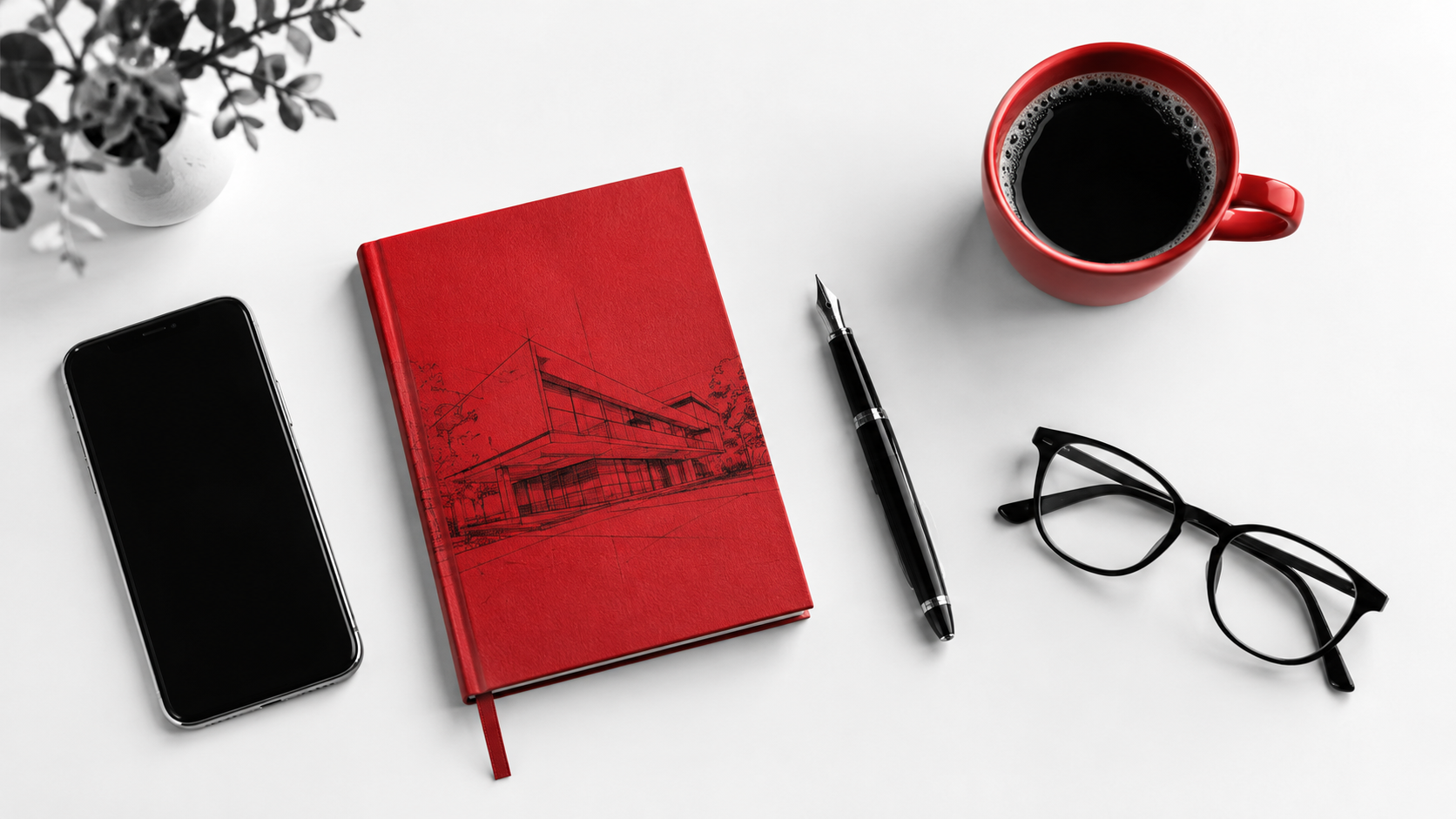 Notebook, phone and coffee on a desk